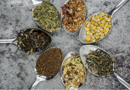 pic of spoons of various herbs arranged in a circle on a tabletop